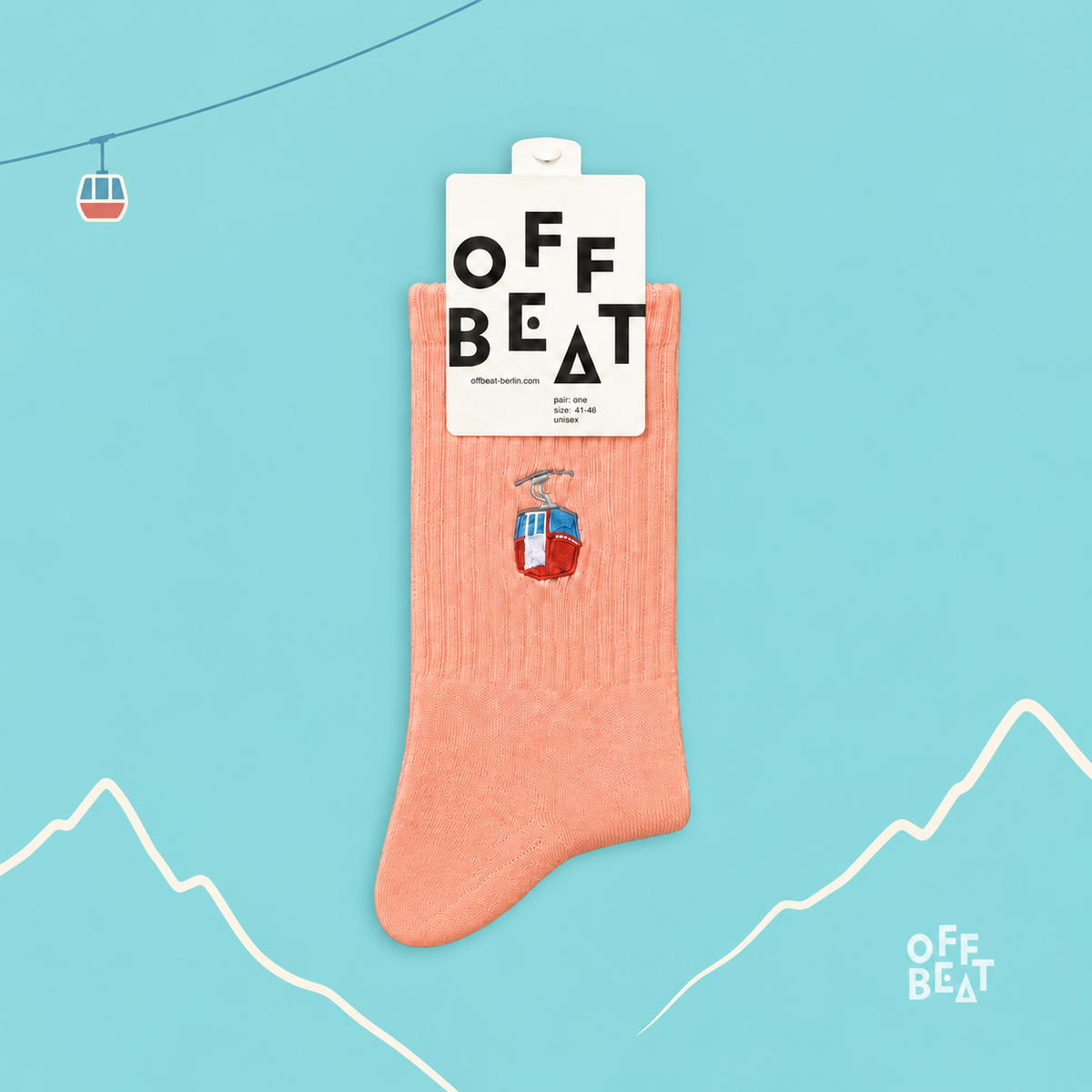 Coral embroidered cable car socks on a turquoise Alpine cable car background